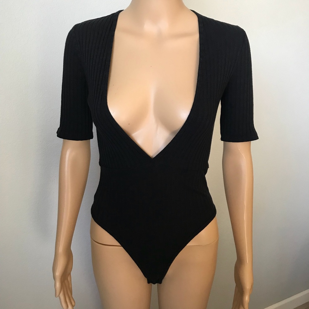Black medium body suit. Deep V neck.